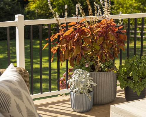 White vinyl deck railing with black balusters