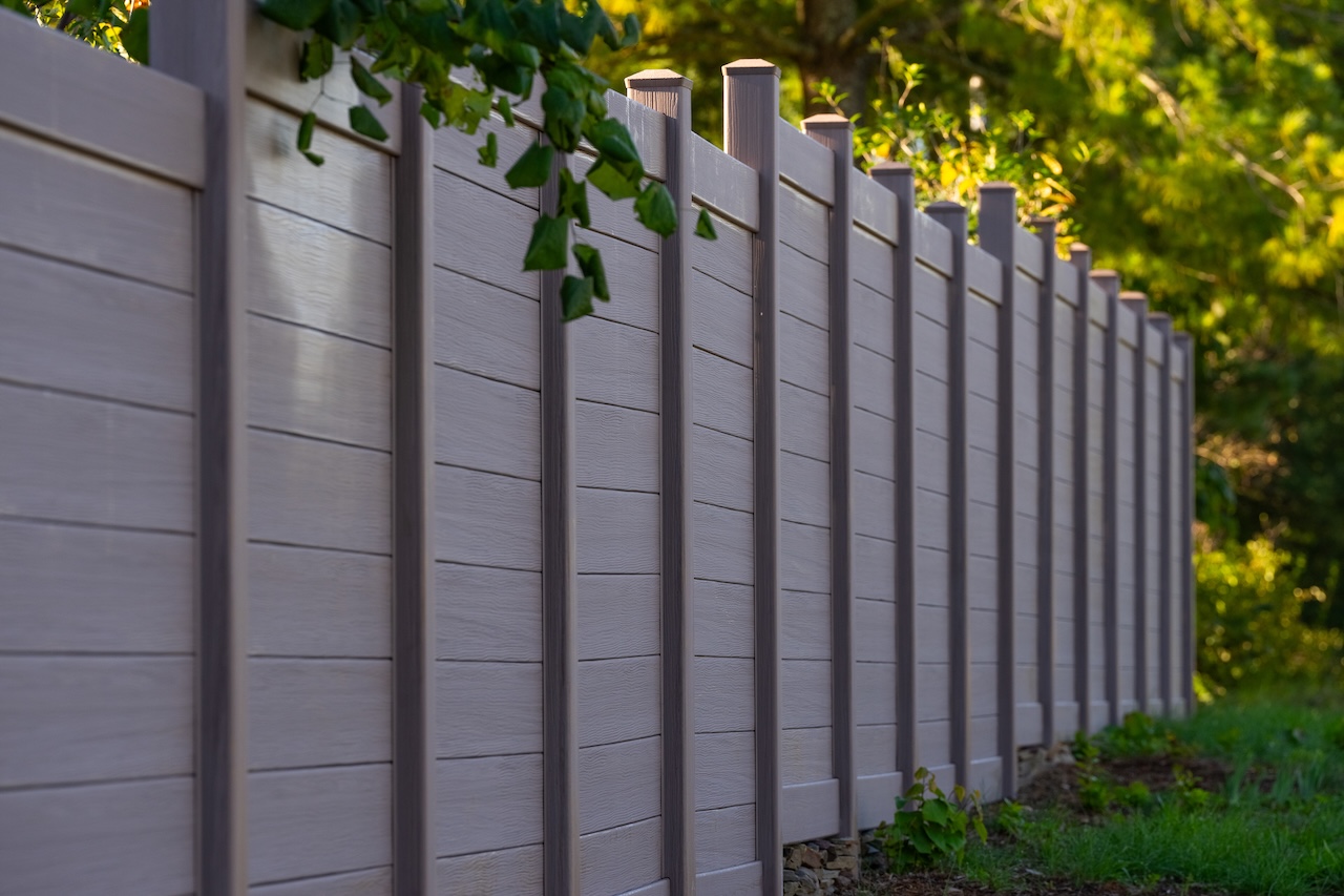 Brown vinyl fencing with horizontal slats